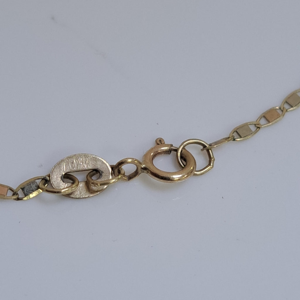 CADENA,MEDALLA RELIGIOSA ORO 10 K 2,20 GRMS (SEMINUEVO)