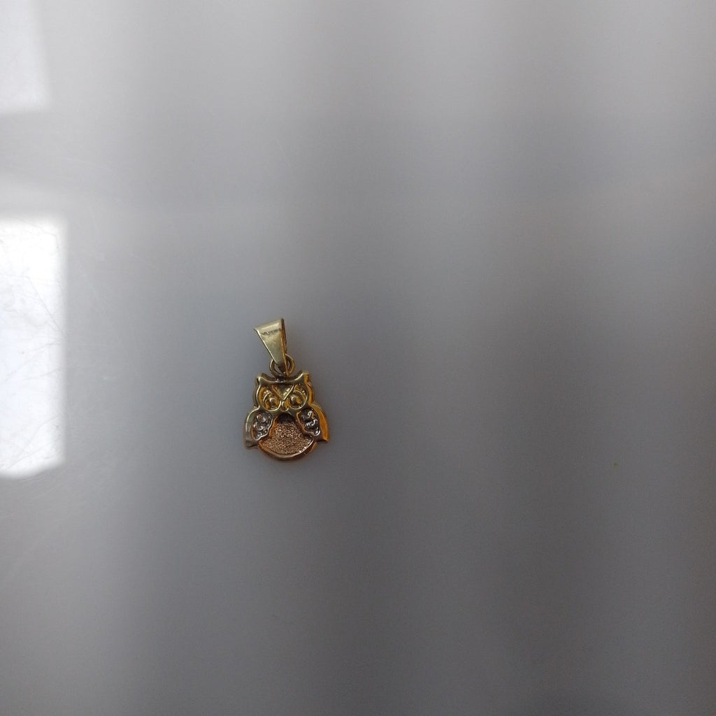 DIJE ORO, ORO COMBINADO 10 K 0.3 GRMS (SEMINUEVO)