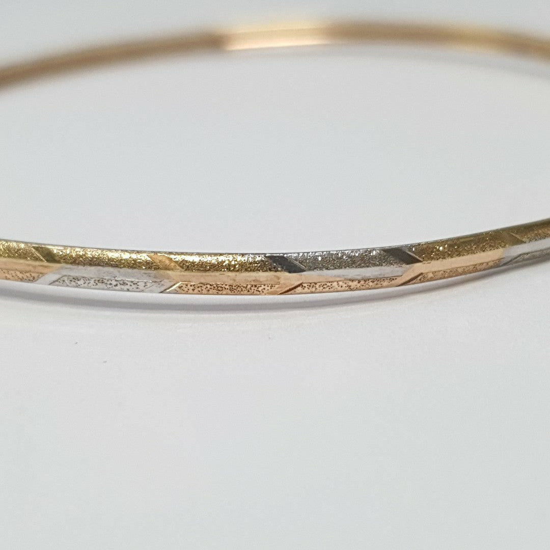 PULSERA RIGIDA ORO COMBINADO 10 K 3,40 GRMS (SEMINUEVO)