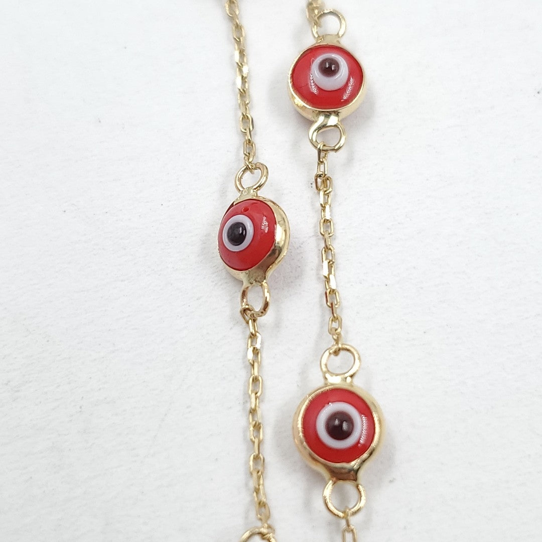 Pulsera para Dama Oro combinado 14 K 1.2 gr Tejido Especial &quot;Ojo turco&quot; con Sintetica color rojo (nuevo)