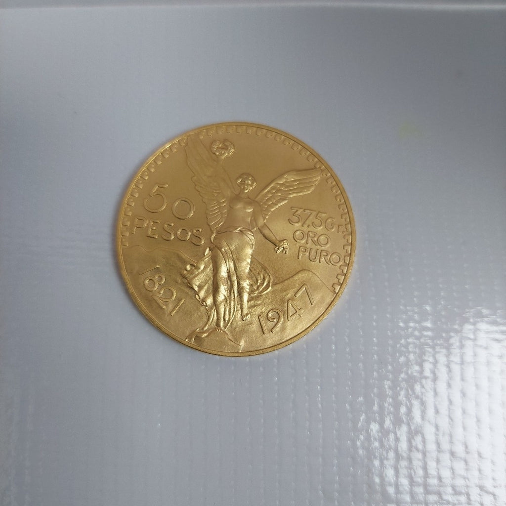 K1 41.6 GRMS - DESC.  0 GRAMOS - 21 K - AVALÚO  76377.6 * * IDENTIFICACIÓN  MONEDA NOMINATIVA. * MONEDAS PESOS  50 PESO (SEMINUEVO)