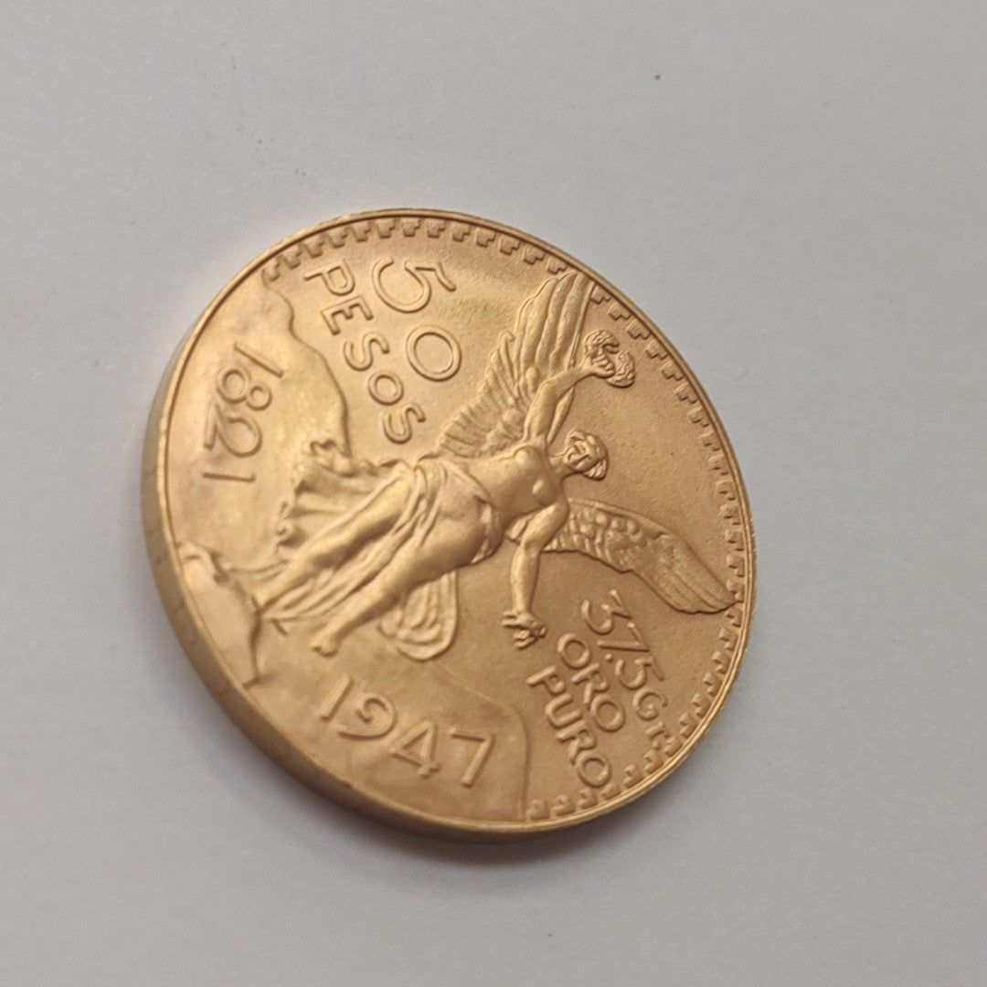 K1 41.6 GRMS - DESC.  0 GRAMOS - 21 K - AVALÚO  71884.8 * * IDENTIFICACIÓN  MONEDA NOMINATIVA. * MONEDAS PESOS  50 PESO (SEMINUEVO)