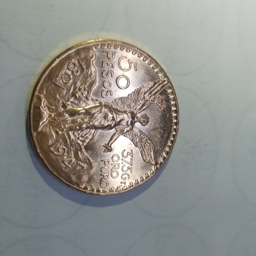 K1 41,60 GRMS - DTO. 0,00 GRMS - 21 K - AVALÚO 76003,20 * IDENTIFICACIÓN  MONEDA NOMINATIVA * MONEDAS PESOS  50 PESOS (SEMINUEVO)