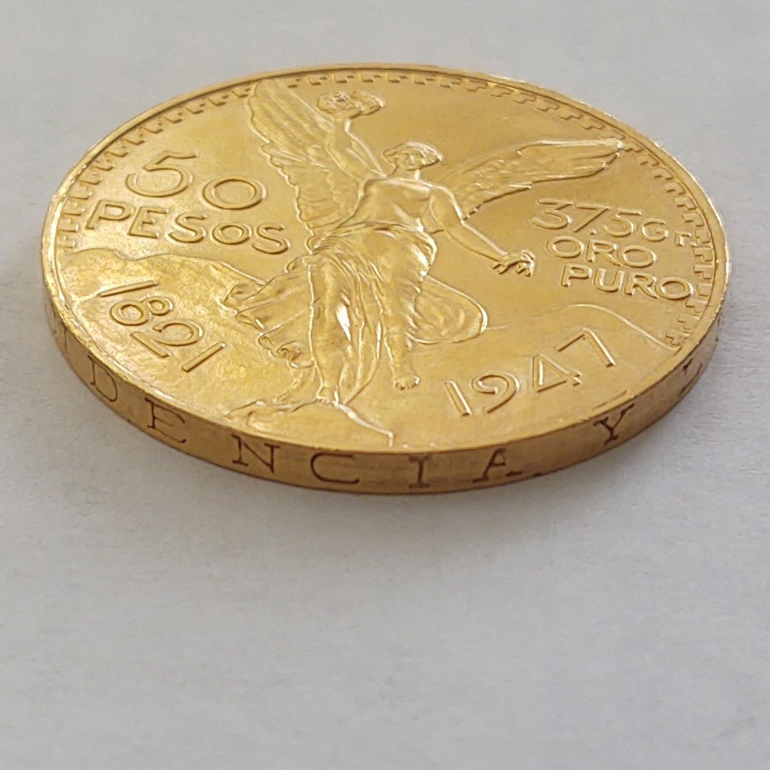 K1 41,60 GRMS - DTO. 0,00 GRMS - 21 K - AVALÚO 80496,00 * IDENTIFICACIÓN  MONEDA NOMINATIVA * MONEDAS PESOS  50 PESOS (SEMINUEVO)