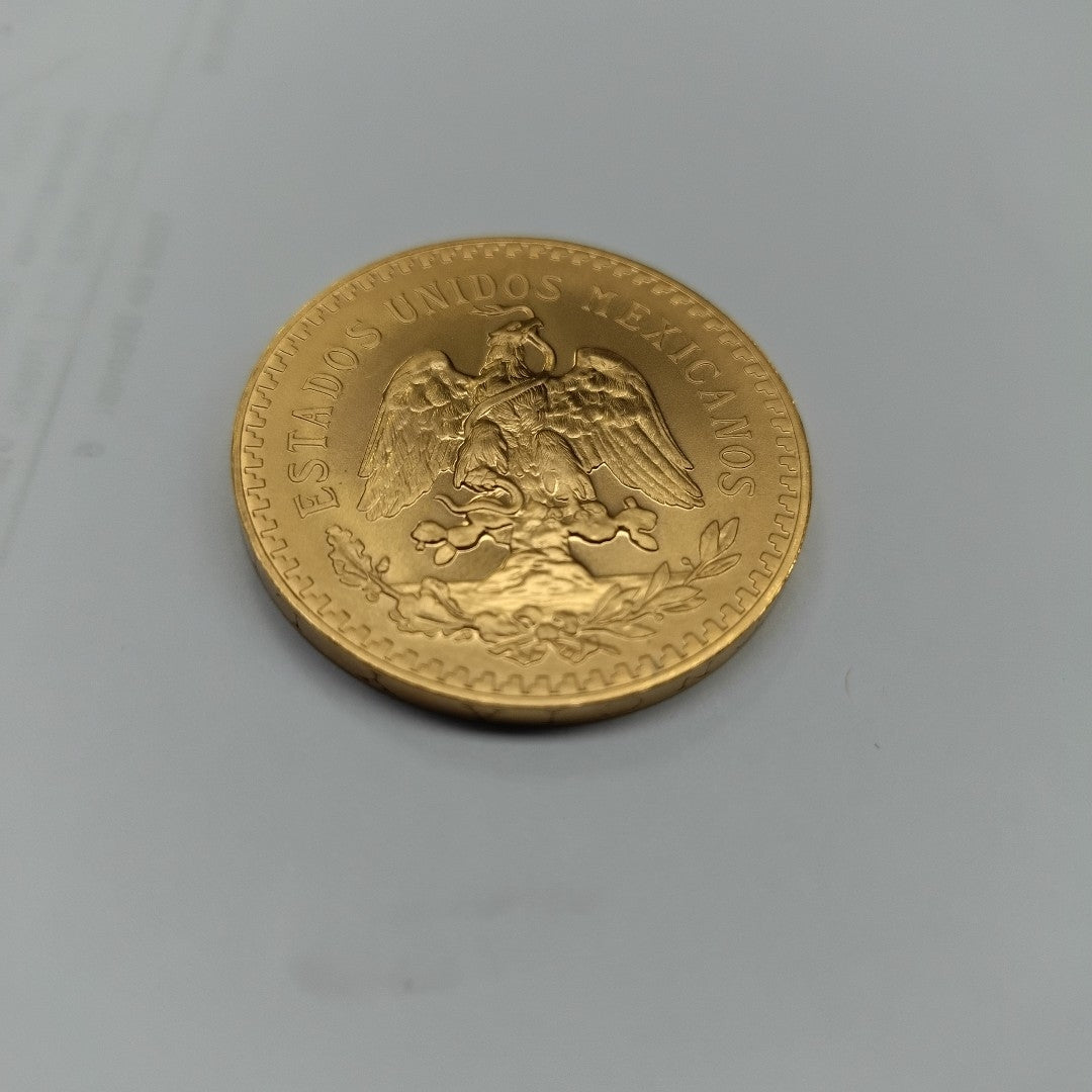K1 41.6 GRMS - DESC.  0 GRAMOS - 21 K - AVALÚO  77126.4 * * IDENTIFICACIÓN  MONEDA NOMINATIVA. * MONEDAS PESOS  50 PESO (SEMINUEVO)