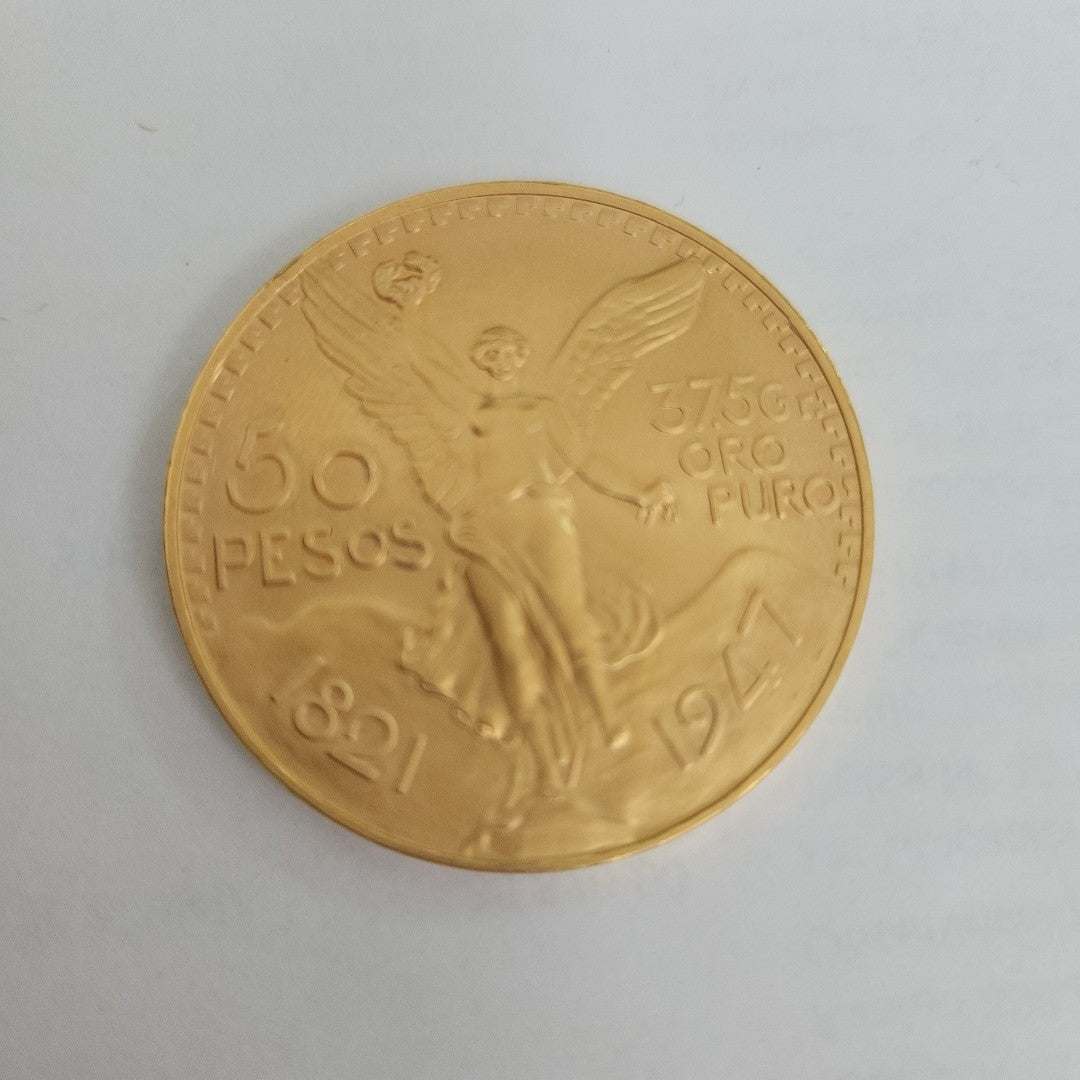 K1 41.6 GRMS - DESC.  0 GRAMOS - 21 K - AVALÚO  75254.4 * * IDENTIFICACIÓN  MONEDA NOMINATIVA. * MONEDAS PESOS  50 PESO (SEMINUEVO)