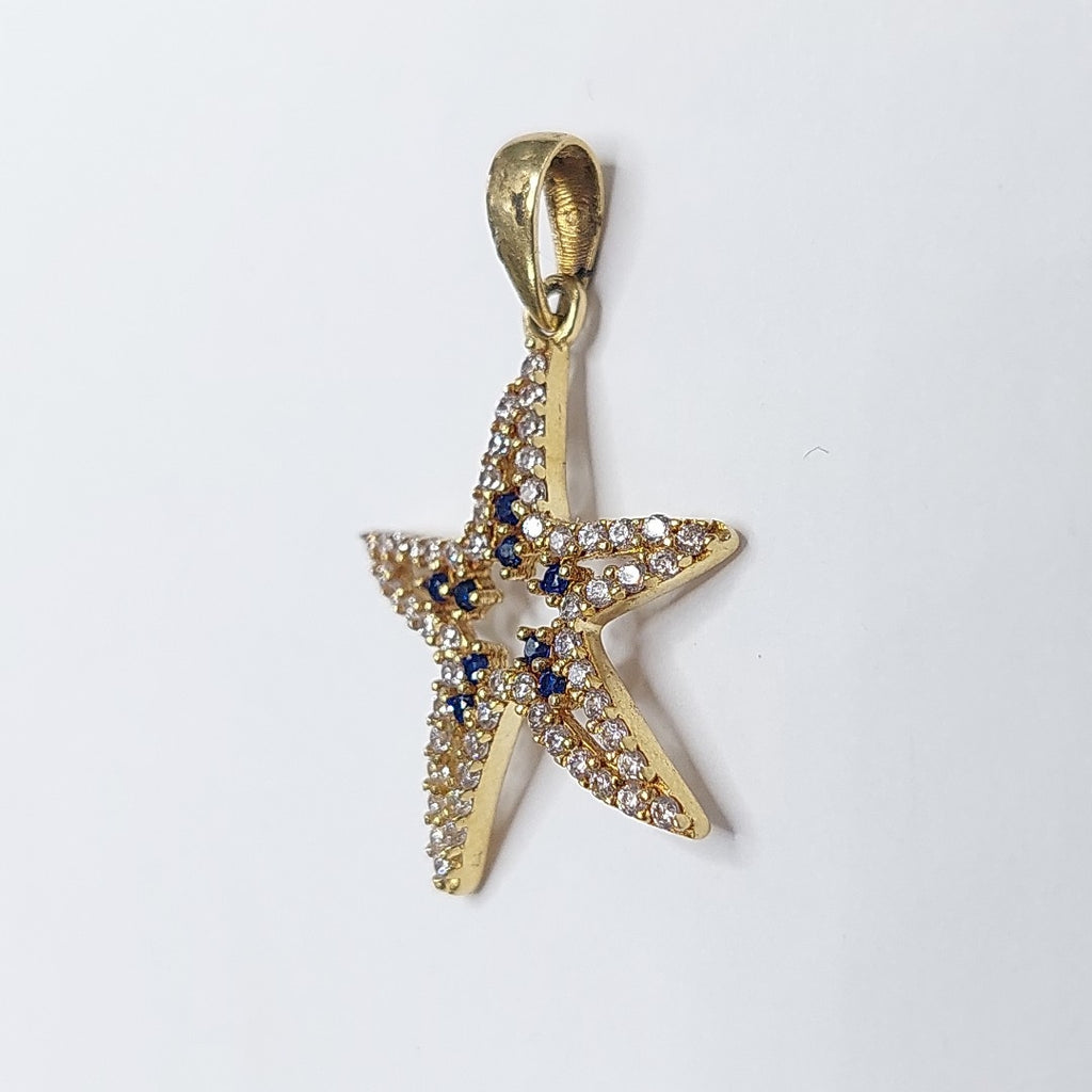 10297DIJ00000B363 FRD5 DIJE ESTRELLA DE MAR CON CIRCONIAS BLANCAS Y AZULES ORO 14K 1.5GRS (NUEVO)