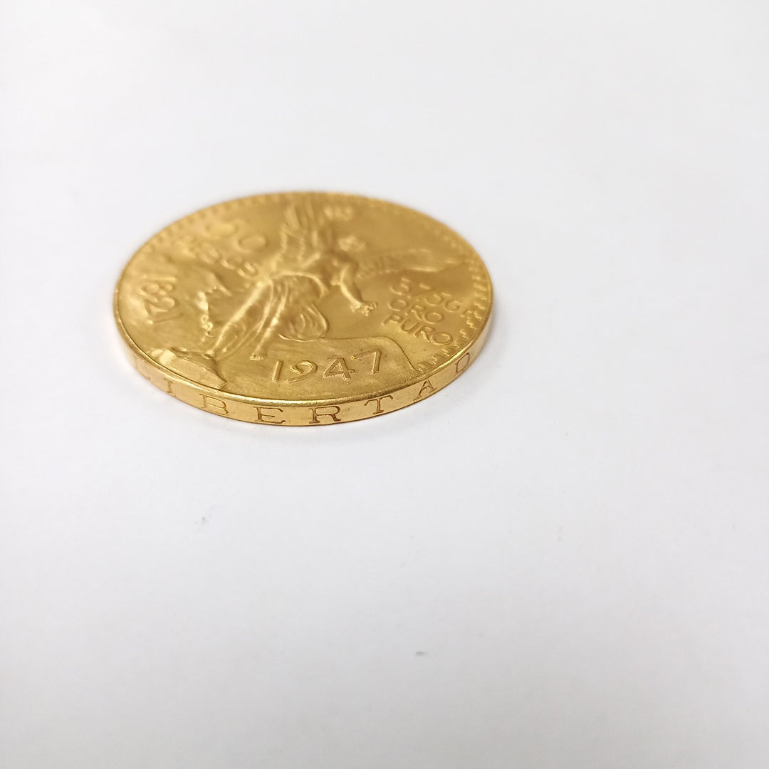 K1 41.6 GRMS - DESC. 0 GRAMOS - 21 K - AVALÚO 71884.8 * * IDENTIFICACIÓN MONEDA NOMINATIVA. * MONEDAS PESOS 50 PESO (SEMINUEVO)