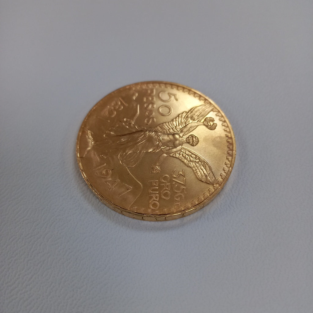 K1 41.6 GRMS - DESC. 0 GRAMOS - 21 K - AVALÚO 75254.4 * * IDENTIFICACIÓN MONEDA NOMINATIVA. * MONEDAS PESOS 50 PESO (SEMINUEVO)