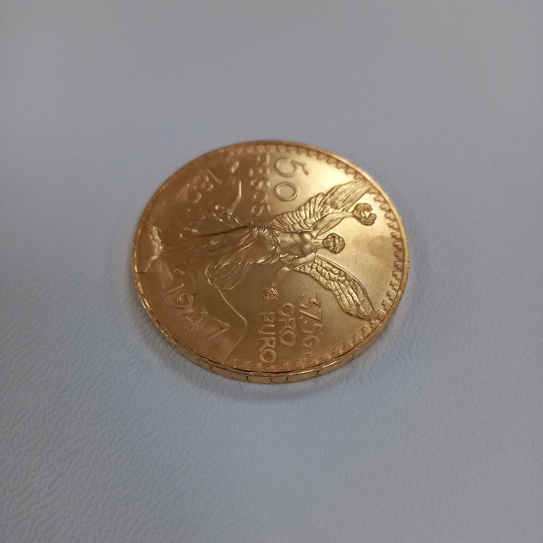 K1 41.6 GRMS - DESC. 0 GRAMOS - 21 K - AVALÚO 75254.4 * * IDENTIFICACIÓN MONEDA NOMINATIVA. * MONEDAS PESOS 50 PESO (SEMINUEVO)