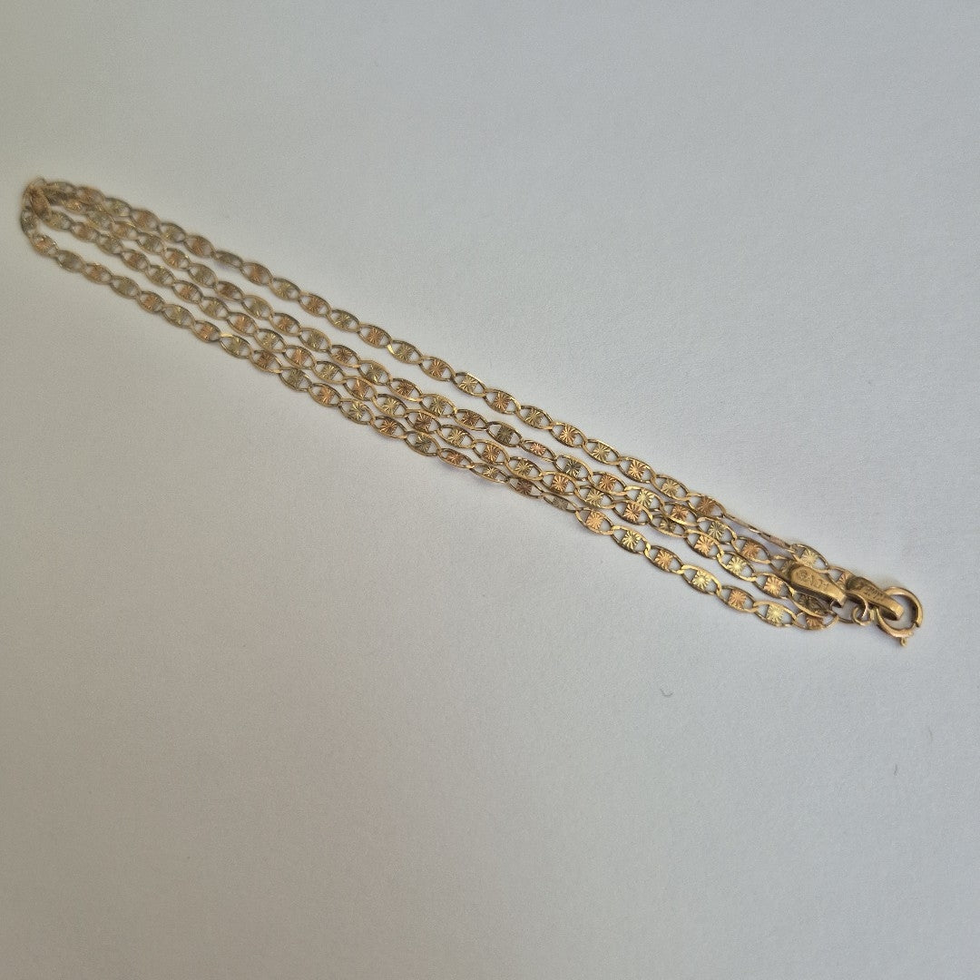 CADENA. ORO, ORO COMBINADO. 10 K 2.1 GRMS (SEMINUEVO)