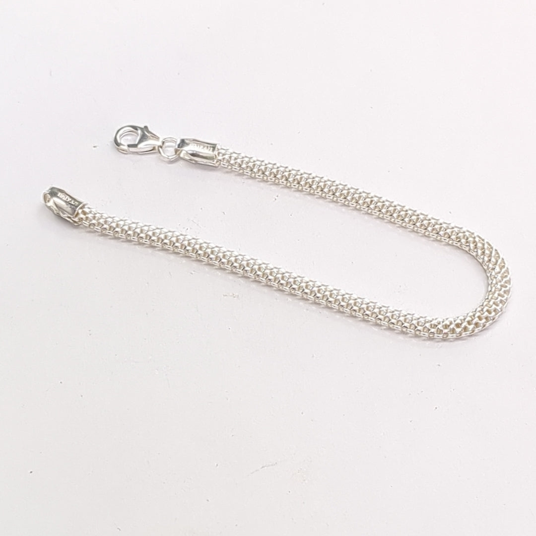 PULSERA TEJIDO ESPECIAL PLATA .925 18 CM 4.9 GR (NUEVO)