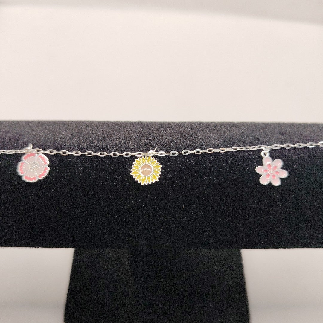 PULSERA TEJIDO ESPECIAL CON DIJE FLORES PLATA .925 21 CM 2.3 GR (NUEVO)