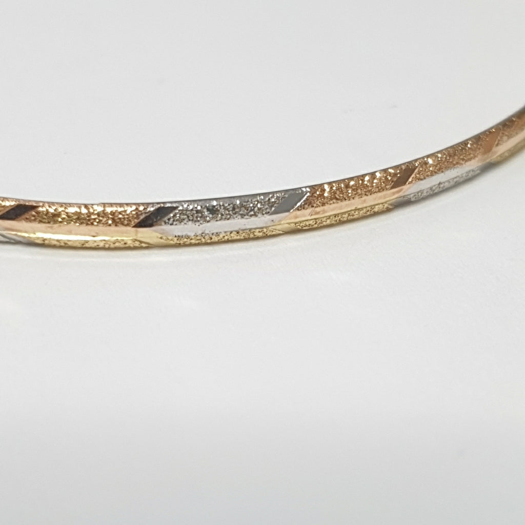 PULSERA RIGIDA ORO COMBINADO 10 K 3,30 GRMS (SEMINUEVO)