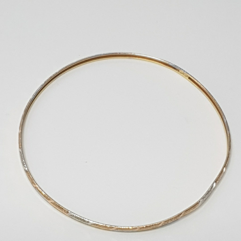 PULSERA RIGIDA ORO COMBINADO 10 K 3,20 GRMS (SEMINUEVO)