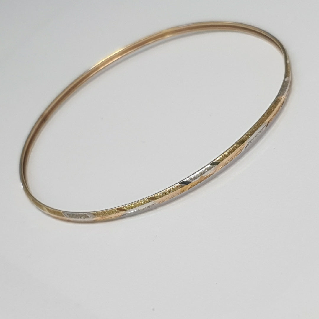 PULSERA RIGIDA ORO COMBINADO 10 K 3,40 GRMS (SEMINUEVO)