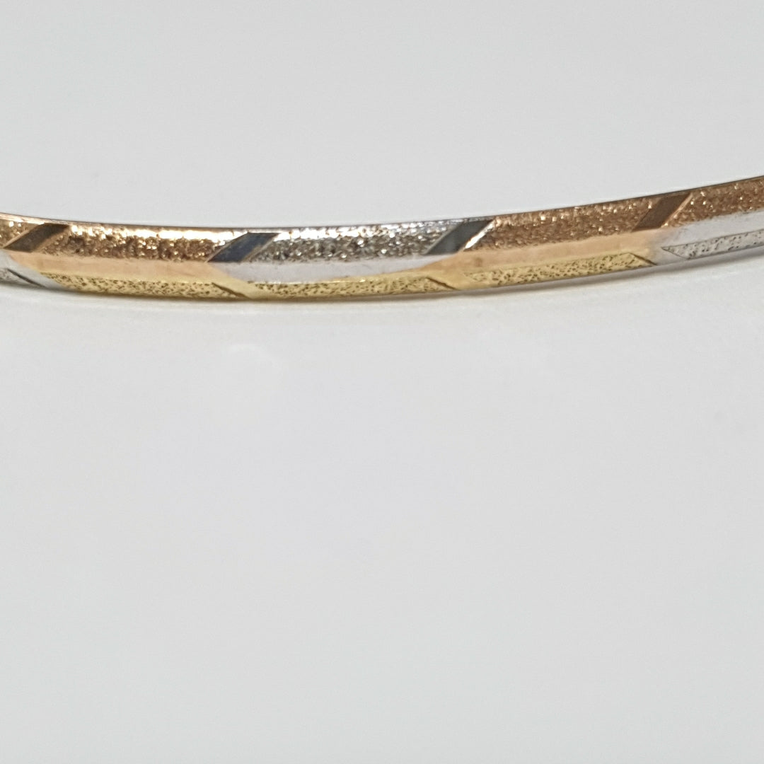 PULSERA RIGIDA ORO COMBINADO 10 K 3,10 GRMS (SEMINUEVO)