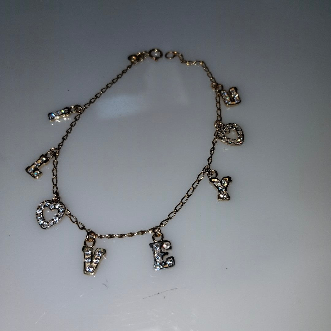PULSERA ESPECIAL CON DIJES Y CIRCONIAS 14K 18 CM 3.3 GR (NUEVO)