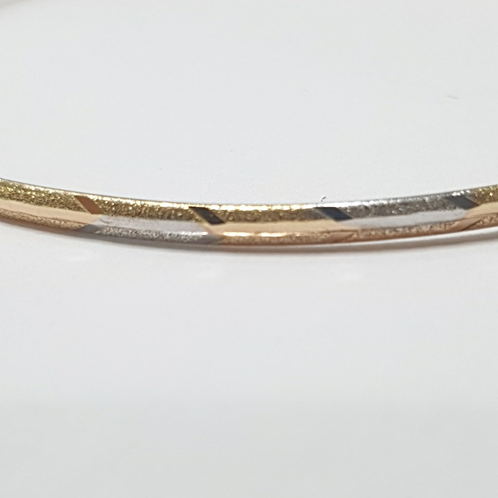 PULSERA RIGIDA ORO COMBINADO 10 K 3,30 GRMS (SEMINUEVO)