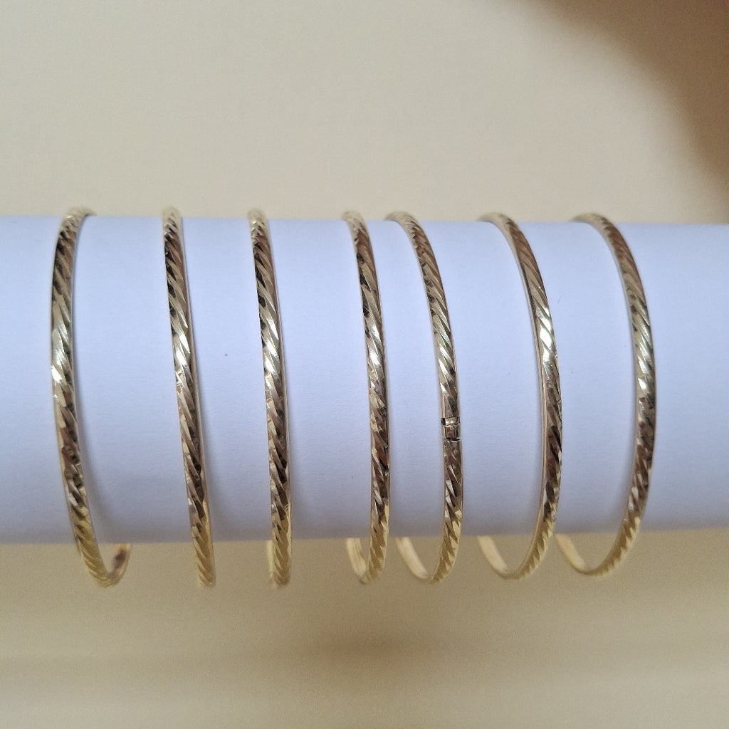 SEMANARIO DE ARGOLLAS,SEMANARIO DE PULSERAS ORO 10 K 22,90 GRMS (SEMINUEVO)