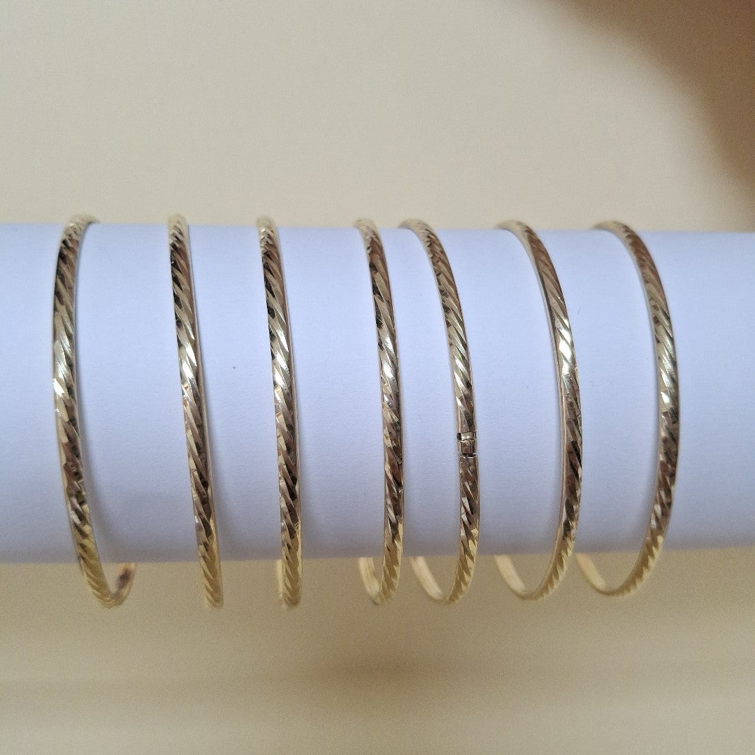 SEMANARIO DE ARGOLLAS,SEMANARIO DE PULSERAS ORO 10 K 22,90 GRMS (SEMINUEVO)