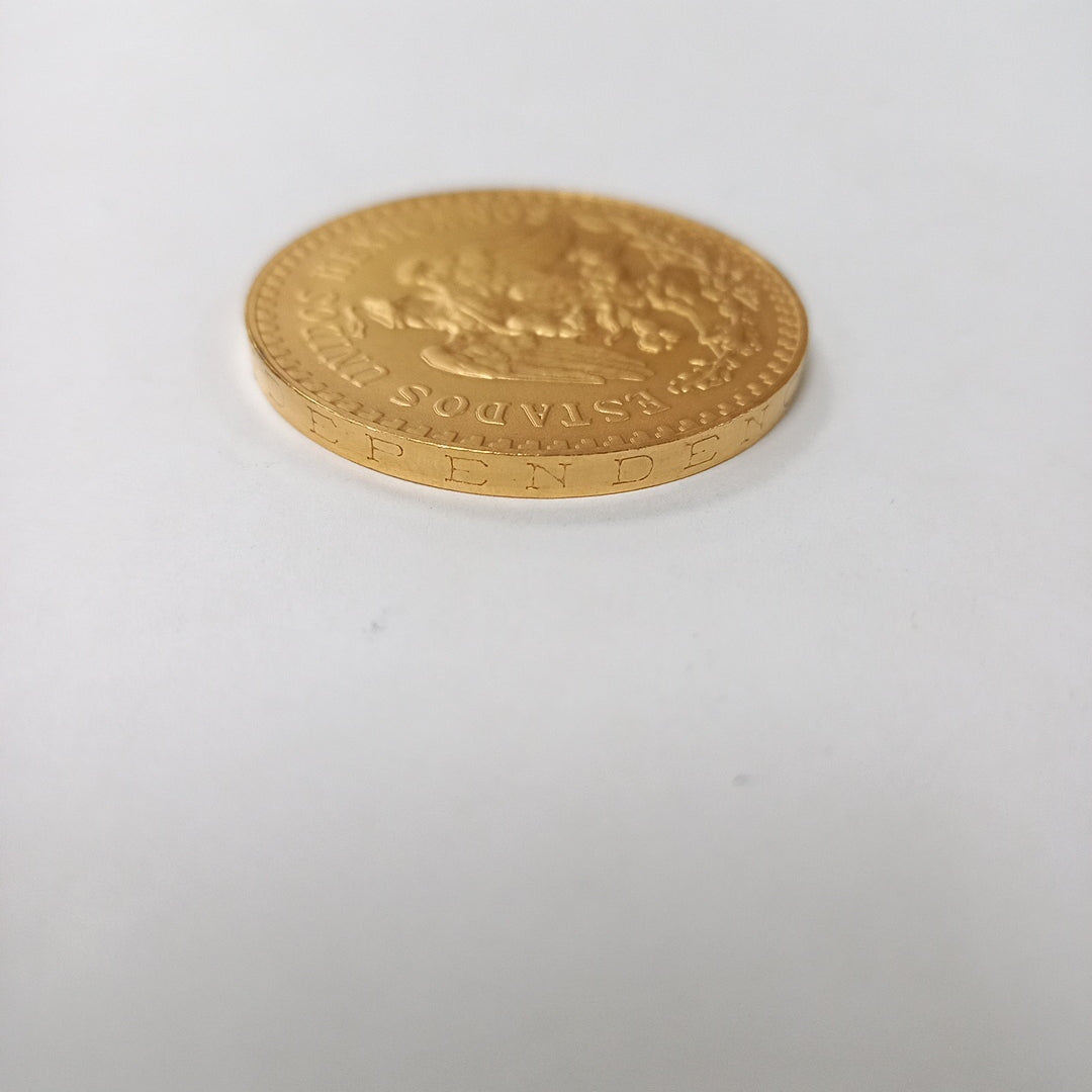 K1 41.6 GRMS - DESC. 0 GRAMOS - 21 K - AVALÚO 71884.8 * * IDENTIFICACIÓN MONEDA NOMINATIVA. * MONEDAS PESOS 50 PESO (SEMINUEVO)